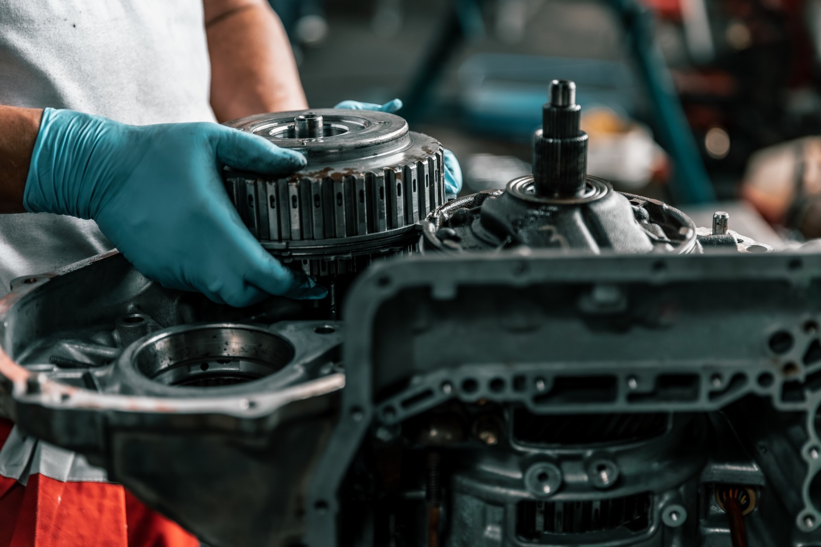 Auto mechanic diagnose and troubleshoots with tools and equipment. Polishing car, fixing braking and steering systems. Measuring oil levels with oil gauge stick and then pouring or changing it.