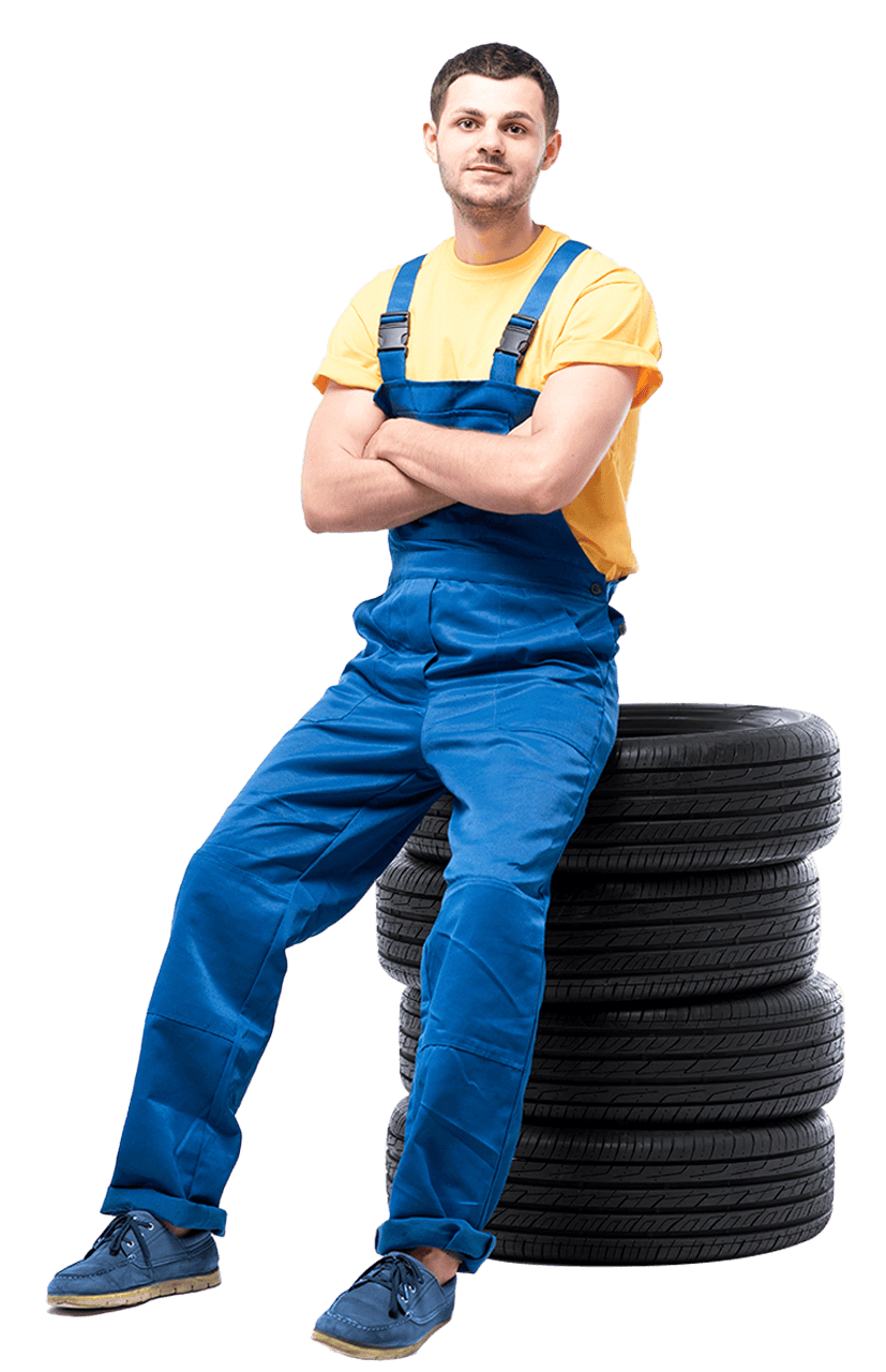 serviceman sitting on a pile of tires